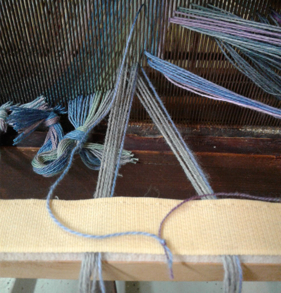 Old and new warp threads tied together